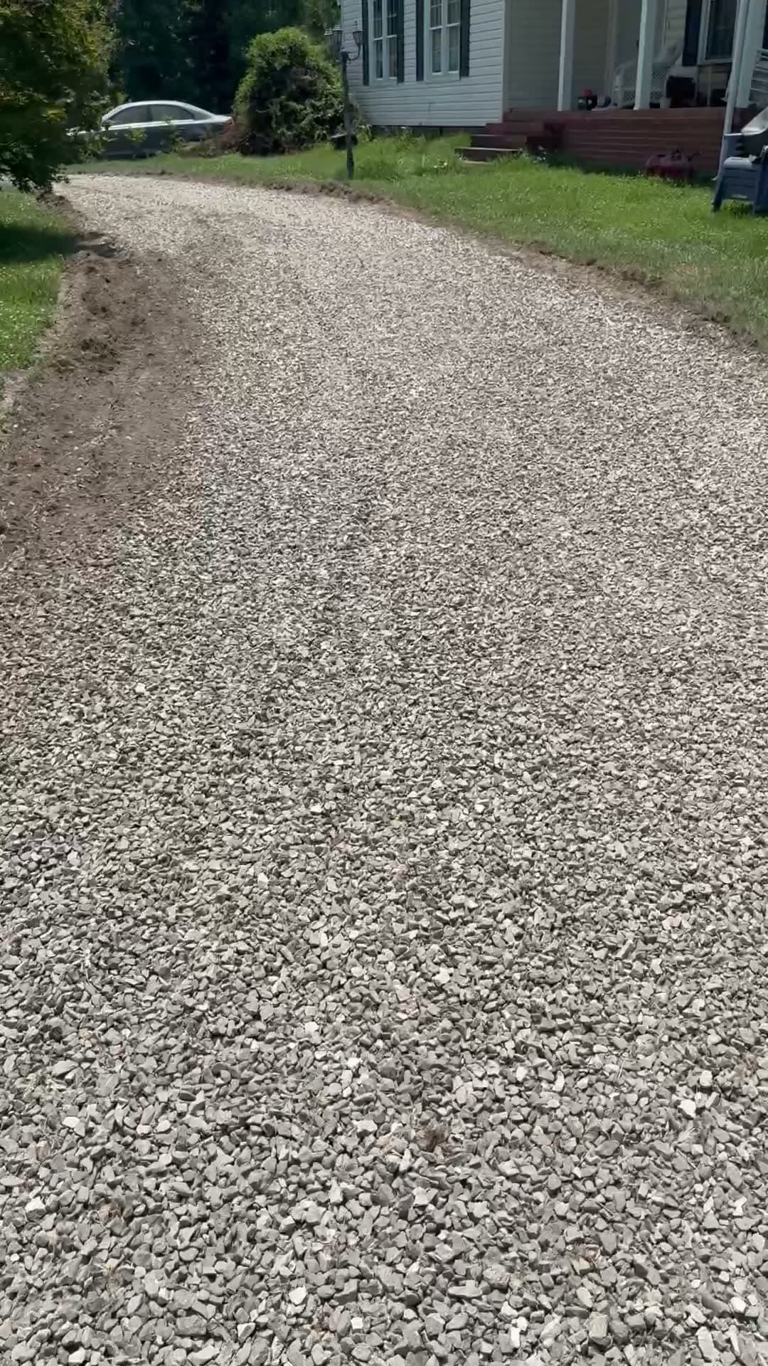 After driveway regrading: Overgrown, weed-choked gravel regraded and restoned